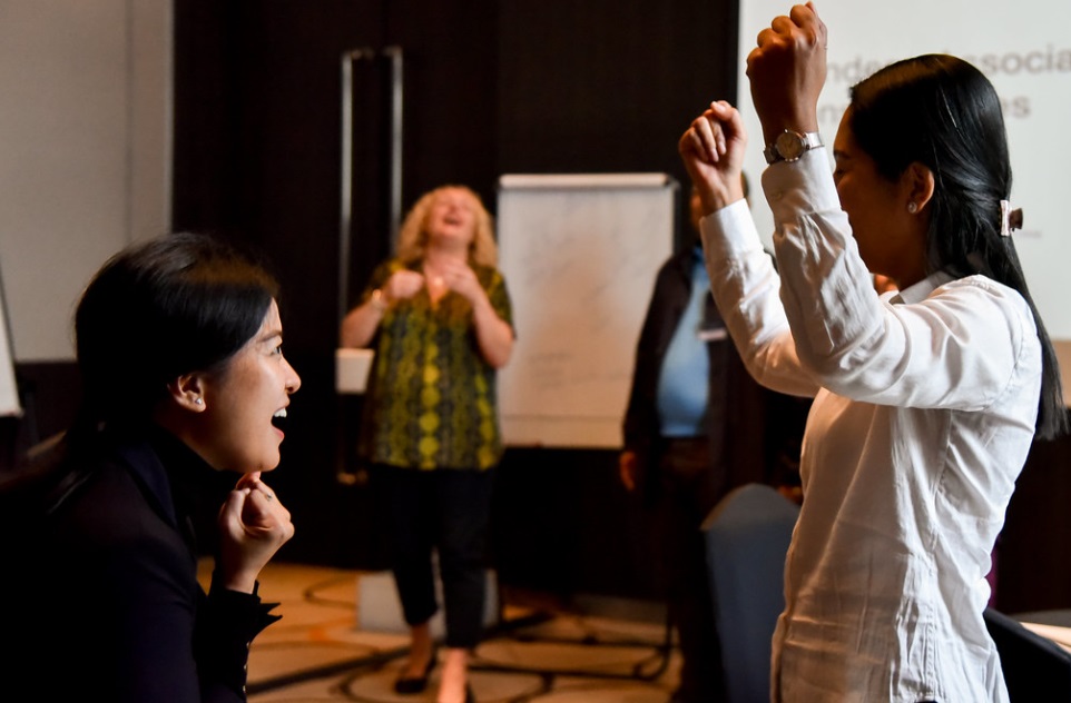 People collaborating in a workplace learning session