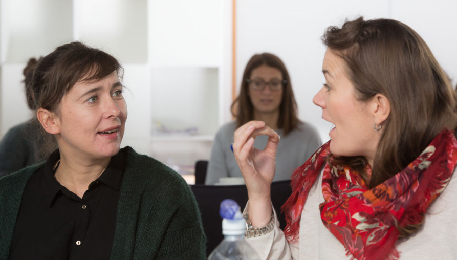 People exploring ideas together at a conference workshop